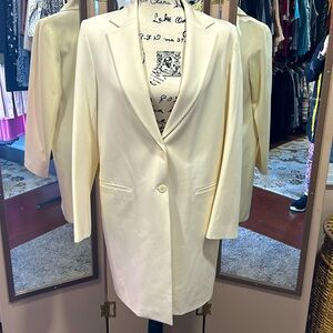 Bloomingdale’s size 12 cream colored 3/4 length coat.